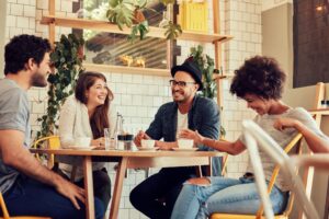 friends chatting as they drink coffee